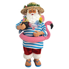 10 inch Swimming Santa figurine wearing blue striped shirt red shorts and straw hat with pink flamingo floatie and coconut drink