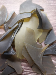 Close-up of frosted olive green seaglass pieces