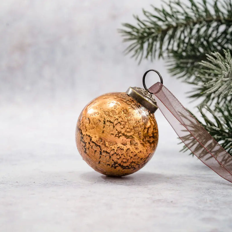 2" Honey Antique Foil Glass Bauble with a textured finish, ornate cap, and organza tie