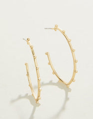 Bobbi Hoop Earrings in matte 18kt gold with textured design.