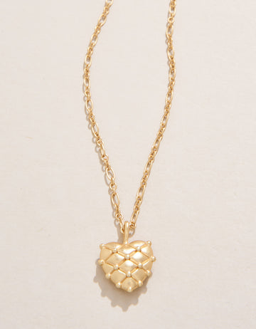  Heart Pillow Necklace with textured heart-shaped pendant in 18kt matte gold plating.