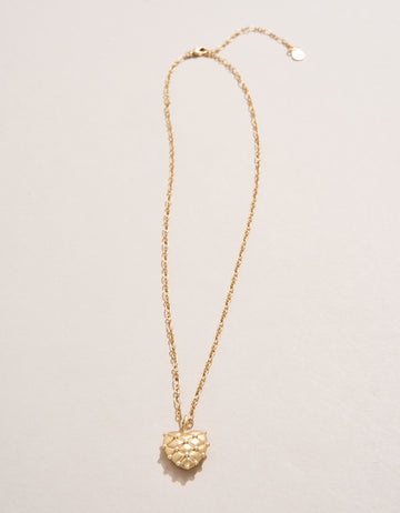  Heart Pillow Necklace with textured heart-shaped pendant in 18kt matte gold plating.