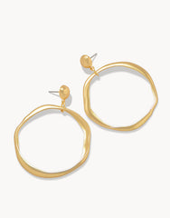 Disco Earrings in 18kt matte gold with a 1970s-inspired circular design.