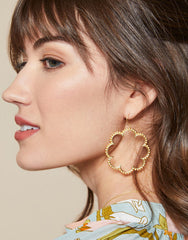 Disco Earrings in 18kt matte gold with a 1970s-inspired circular design.