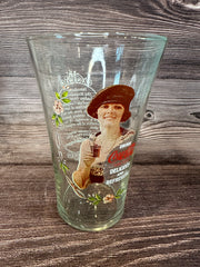 Vintage Coca Cola Magnificent Ladies Collector Series 1 Glasses featuring vibrant images of women in classic Coca-Cola advertising on a wooden surface.
