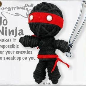 Handmade Jo Ninja String Doll Keychain with stealth-inspired design, featuring fabric tag and lobster clasp.