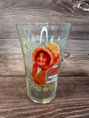 Vintage Coca Cola Magnificent Ladies Collector Series 1 Glasses featuring vibrant images of women in classic Coca-Cola advertising on a wooden surface.