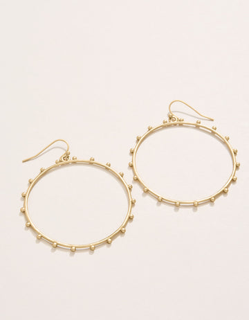 Bobbi Earrings featuring textured 18kt matte gold-plated hoops.