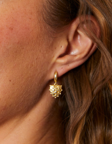 Heart Pillow Earrings with heart-shaped design and pillow texture in 18kt matte gold plating.