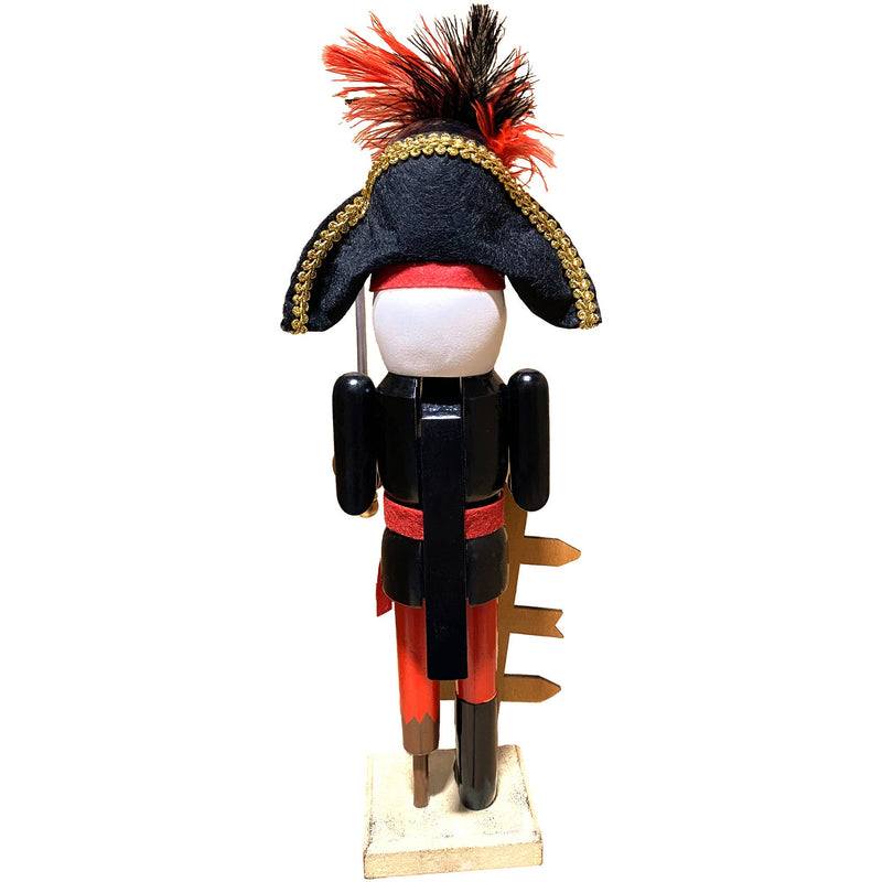 Back of pirate nutcracker showing black and gold coat red sash and tricorn hat