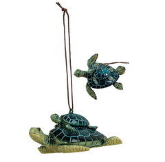 Blue resin mother and baby sea turtle ornament with detailed shells and hanging cord for coastal or holiday décor.