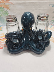 Blue ceramic octopus salt and pepper shakers set with detailed texture and coastal design.