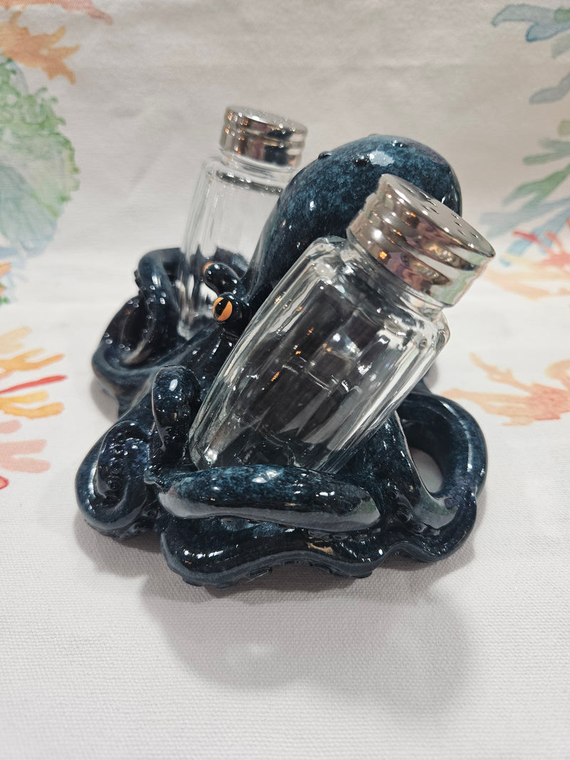 Blue ceramic octopus salt and pepper shakers set with detailed texture and coastal design.