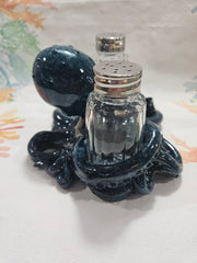 Blue ceramic octopus salt and pepper shakers set with detailed texture and coastal design.
