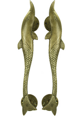 Pair of solid brass dolphin-shaped door handles with textured scale detailing and polished finish.