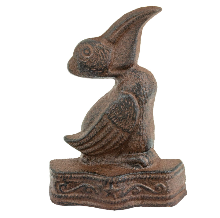 Rustic cast iron pelican door stop with weathered brown finish and detailed coastal design.