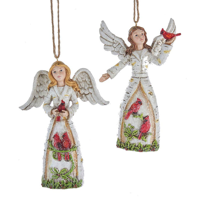 Two angel ornaments with red cardinals on a white background