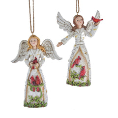 Two angel ornaments with red cardinals on a white background