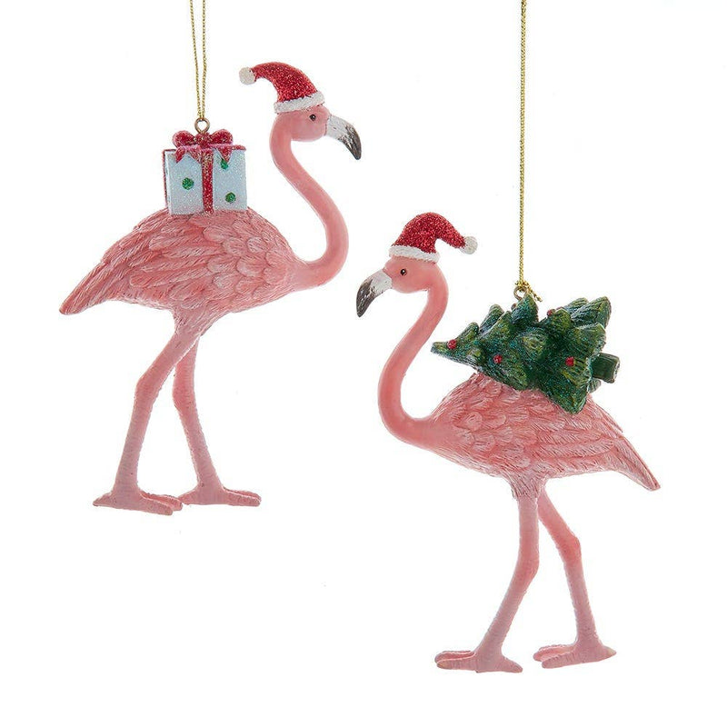 Two pink flamingo Christmas ornaments with Santa hats and gifts on a white background
