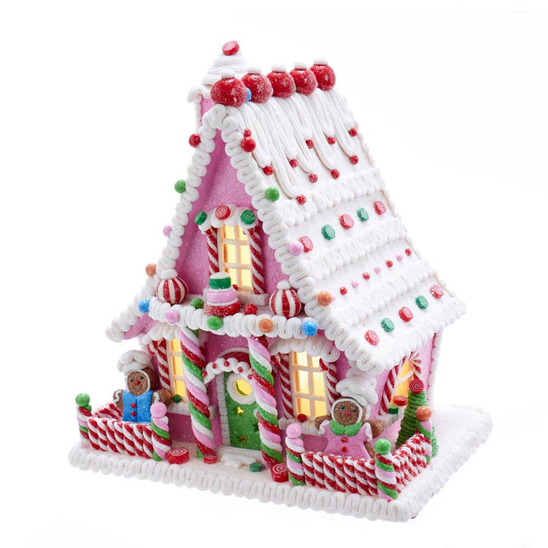 Christmas gingerbread house in candy pink style with LED lights - seasonal holiday decoration