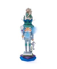coastal nutcracker with green and turquoise glitter, mermaid hat and seahorse on base