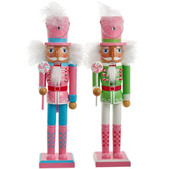 Two nutcrackers in pink and green outfits with candy canes on a white background