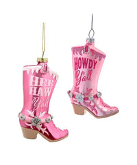 Pink cowboy boot ornaments with decorative elements on a white background