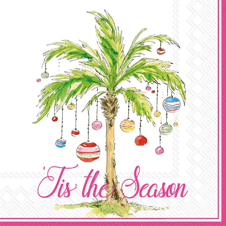 Napkin with a palm tree decorated with Christmas ornaments and 'Tis the Season text.
