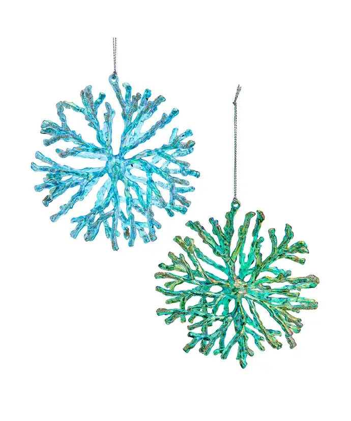 Two turquoise coral-like ornaments on a white background