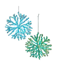 Two turquoise coral-like ornaments on a white background