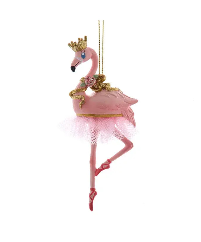 Decorative flamingo ornament with a crown and tutu on a white background