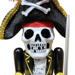 Close-up of skeleton-faced pirate nutcracker with red feather and skull-and-crossbones hat