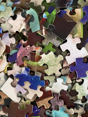 Close-up of puzzle pieces featuring detailed sea glass shapes and colors, emphasizing the high-quality design.