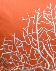 Close-up of the white embroidered coral pattern on the Fan Coral Pillow, showcasing the detailed stitching.