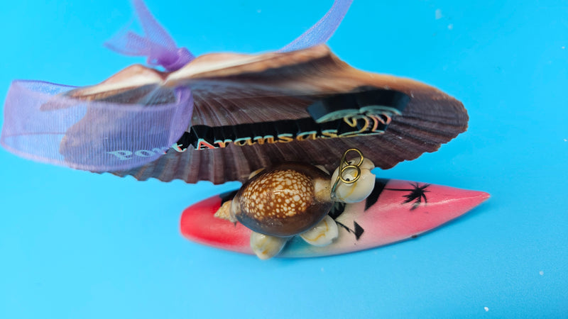Dual-use Port Aransas scallop shell ornament and magnet featuring turtle and surfboard