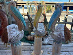 Yellow, blue, and aqua Coconut Pelicans all put side by side. 