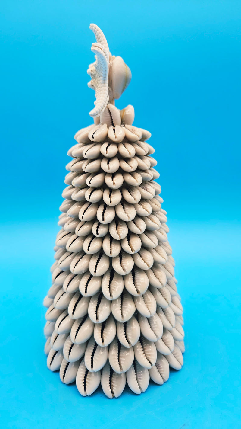 Side view of the 8.75-inch tall Cowrie Shell Tree, showing the conical shape and natural shell texture.