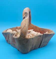Rustic driftwood basket display with shells – nautical decorative piece