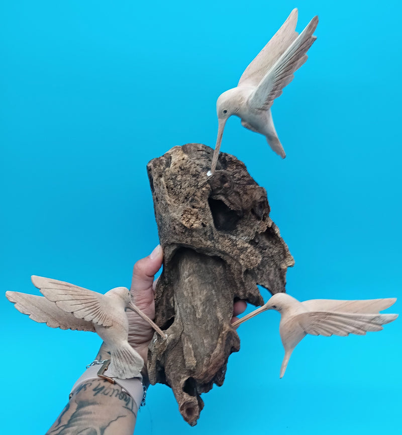 Driftwood wall art with hand-carved hummingbirds in rustic coastal style – decorative accent
