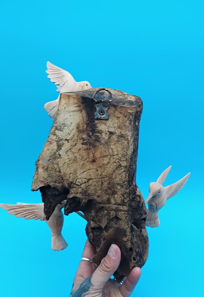 Driftwood wall art with hand-carved hummingbirds in rustic coastal style – decorative accent