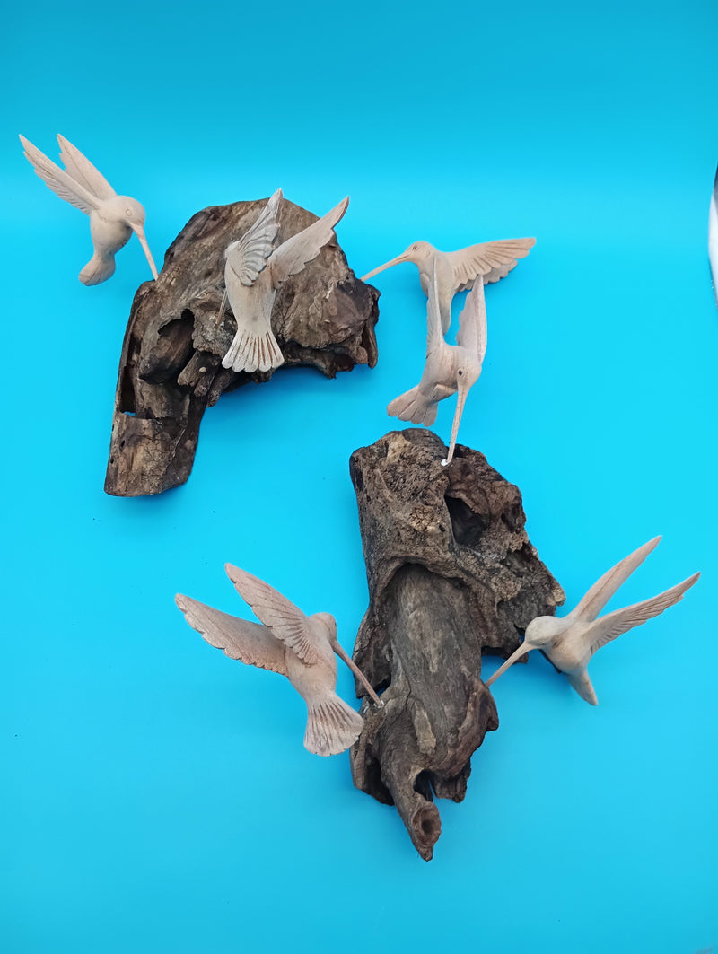 Driftwood wall art with hand-carved hummingbirds in rustic coastal style – decorative accent