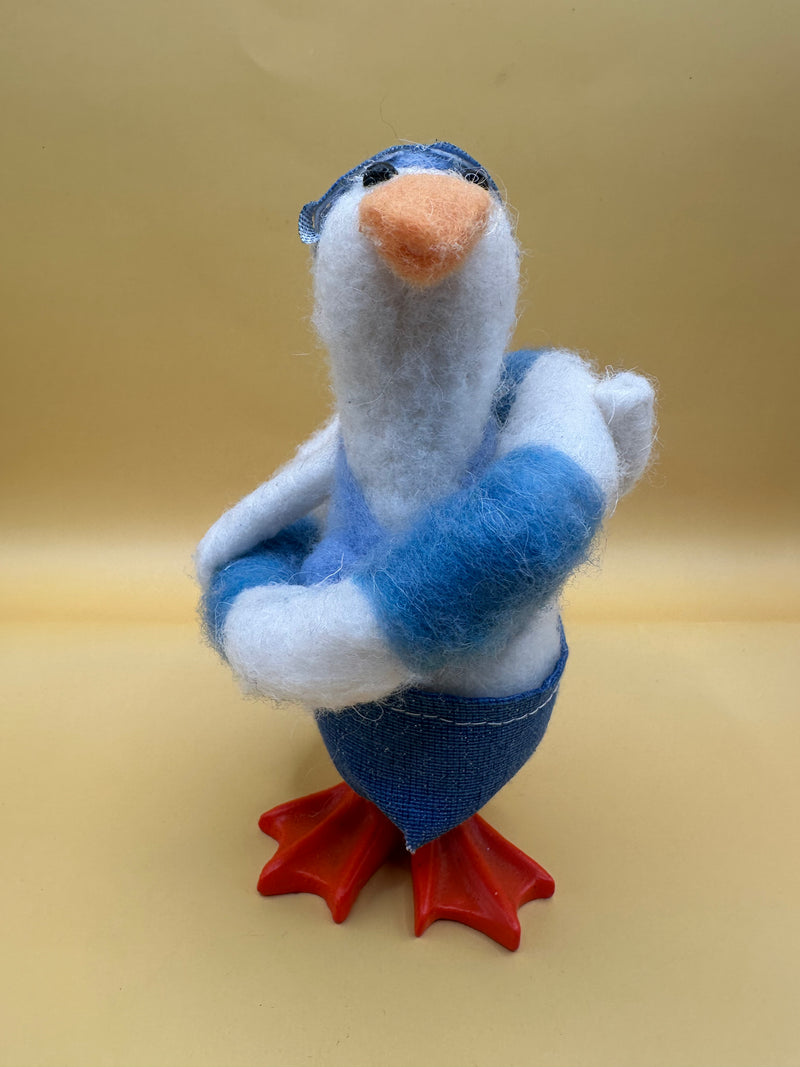Felted wool duck figurine with striped float – angled view