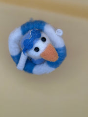 Felted wool duck figurine with striped float – top view