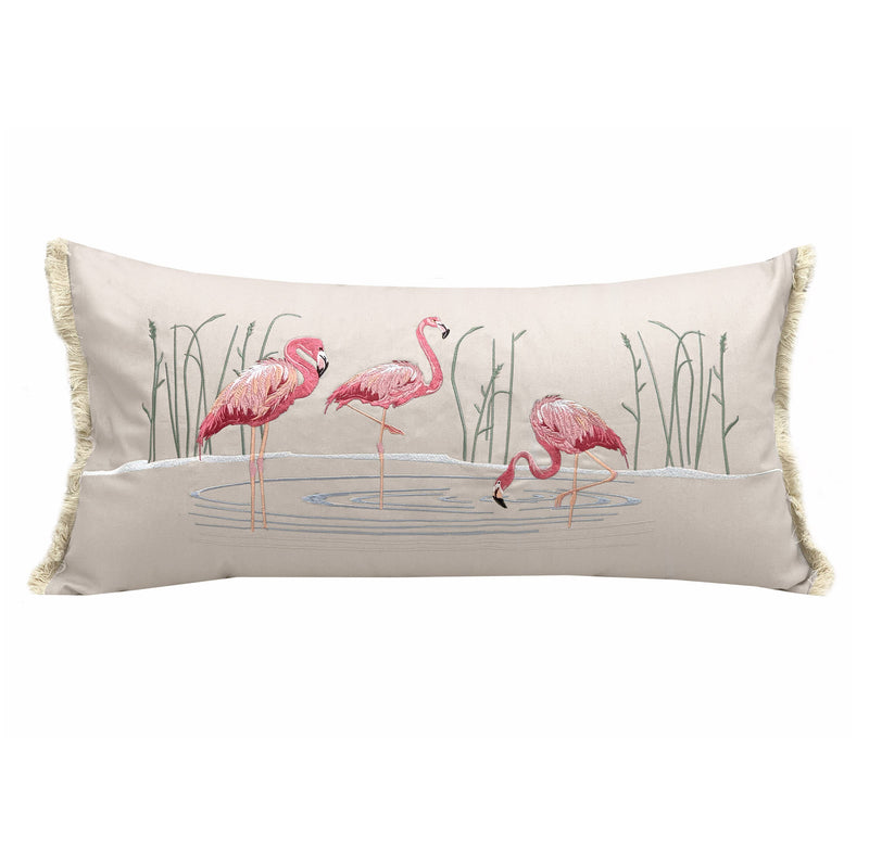 Flamboyance Lumbar Pillow featuring embroidered flamingos wading along the water's edge with fringed edges and coastal charm.