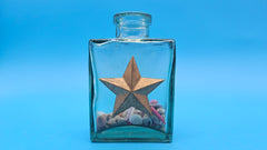 Glass bottle with star in rustic style – coastal home decor accessory