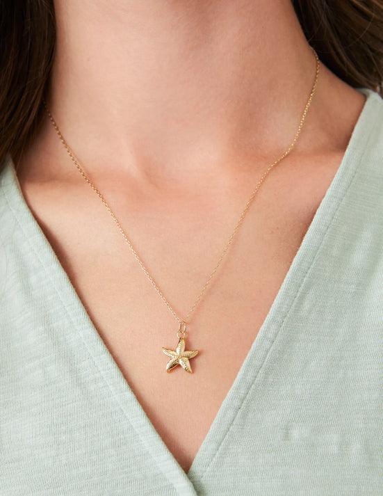 Gold-plated starfish necklace on 18" chain with lobster clasp, Worn by a model. 