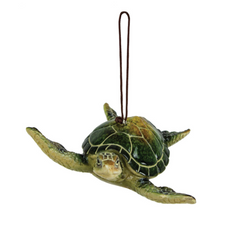 Green resin sea turtle ornament with detailed shell and fins, hanging cord attached for coastal or holiday décor.