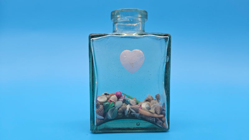 Heart-accented coastal glass bottle – perfect for beach cottage styling