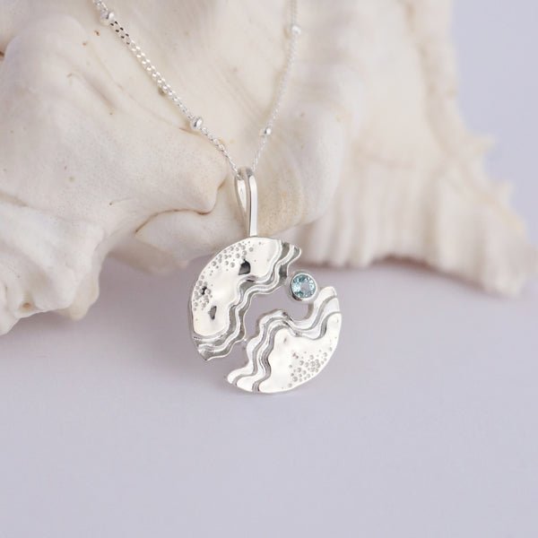 Sterling silver hideaway necklace – light blue Topaz pendant on cable chain