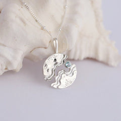 Sterling silver hideaway necklace – light blue Topaz pendant on cable chain